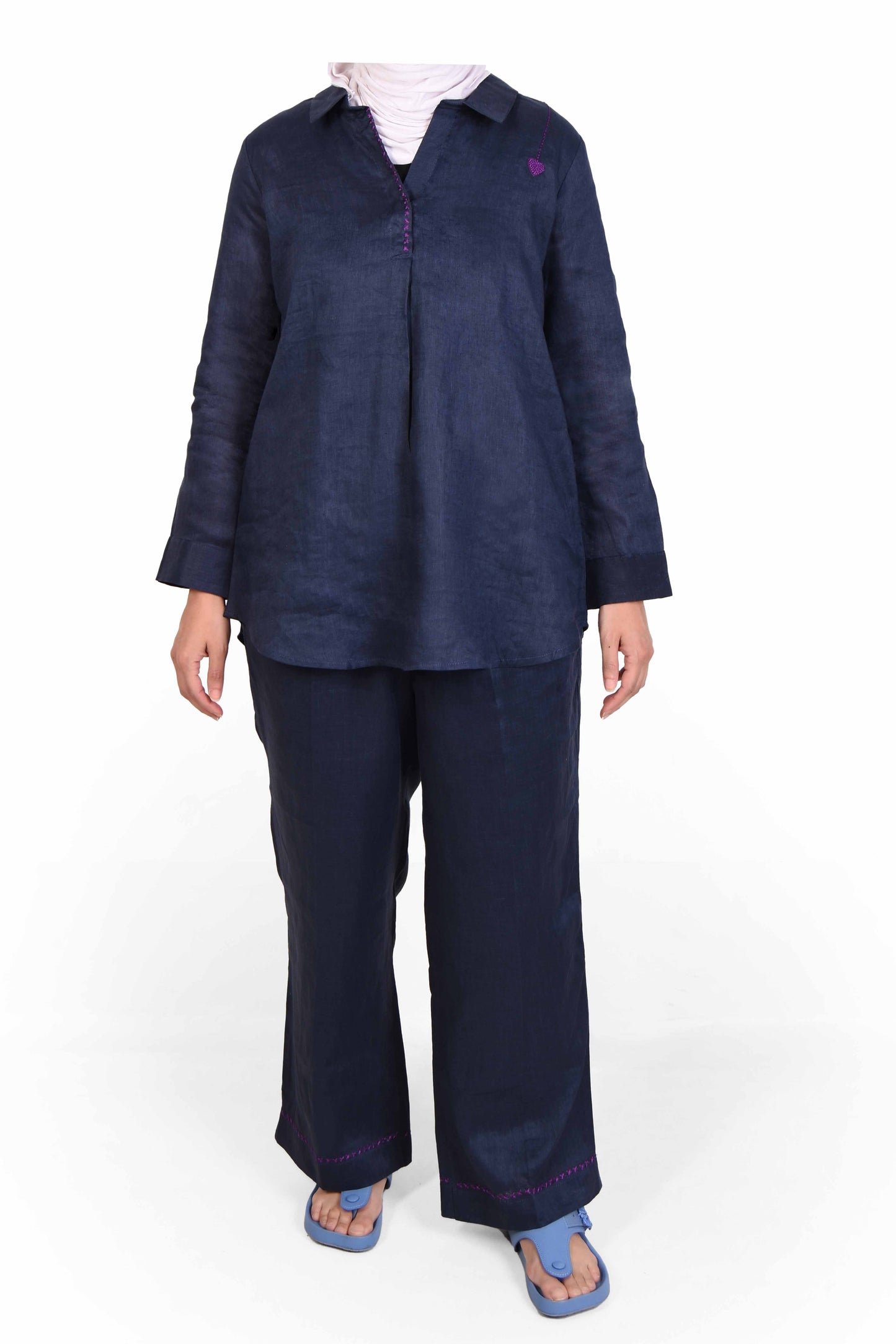 Navy blue outfit with a shirt and pants on a white background