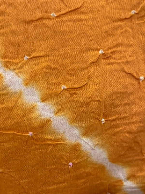 Brown fabric with a white diagonal stripe and pins on a brown background